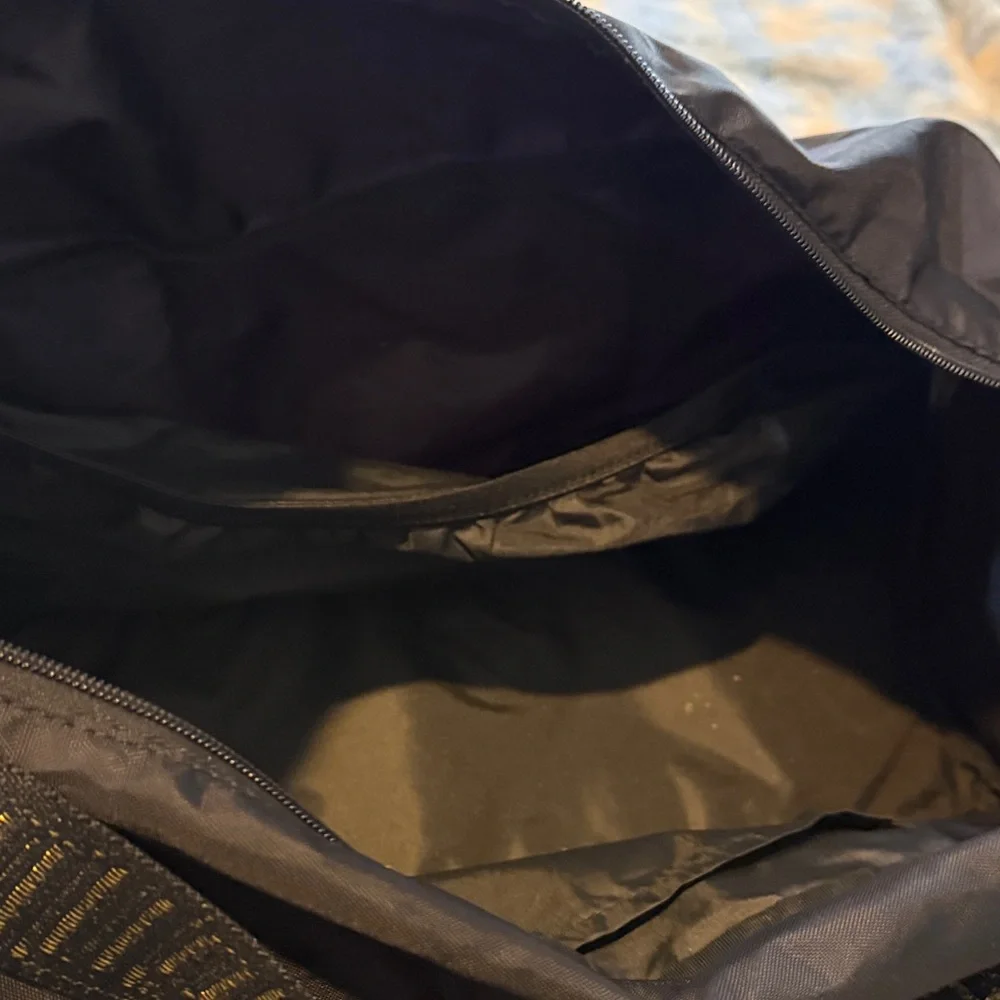 Puma Black Duffel Bag with Gold Puma Logo and Branded Straps